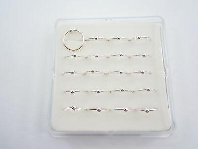 1 scatola di 20 orecchini da naso