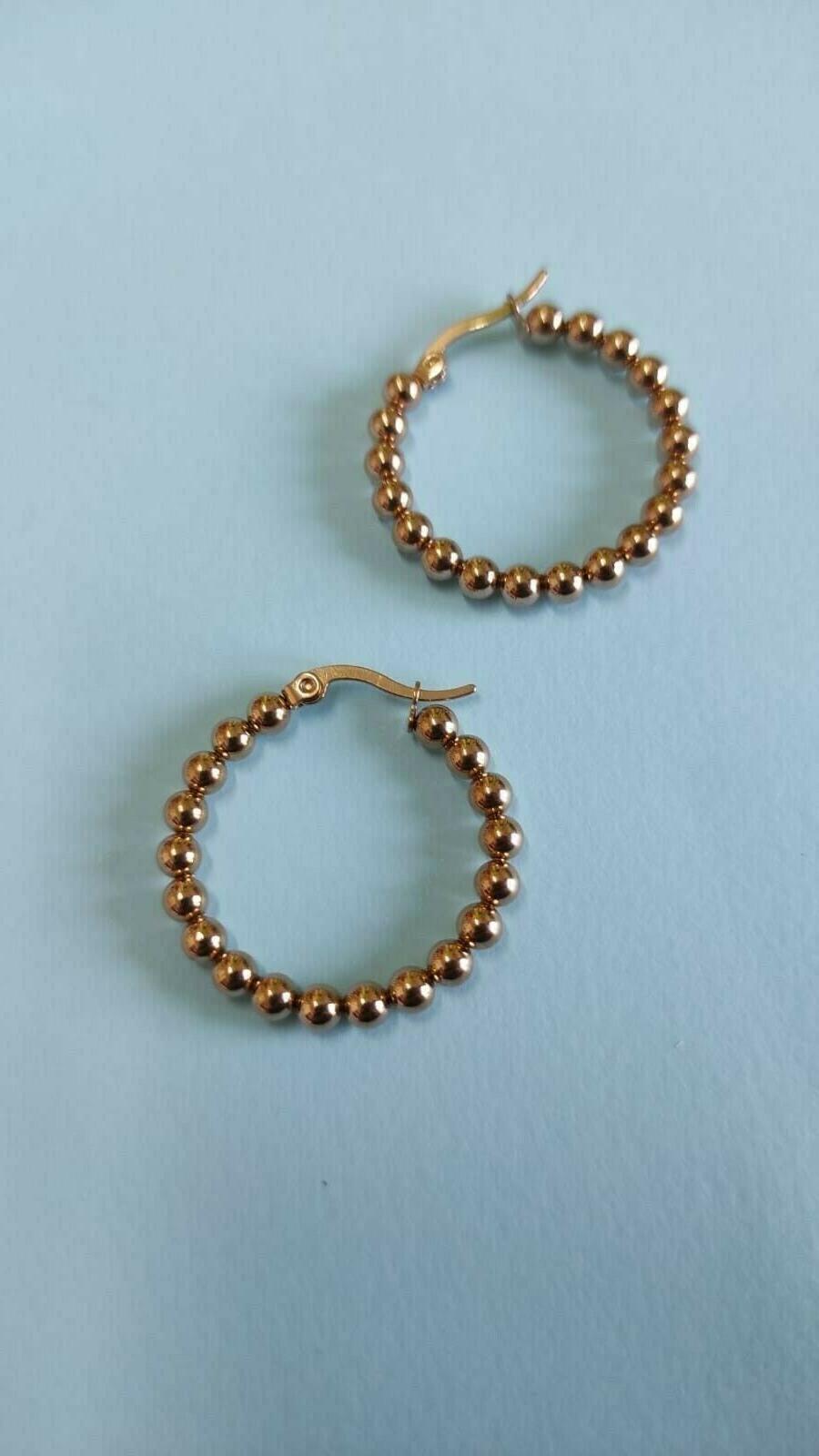 orecchini a cerchio in acciaio dorati bronzo