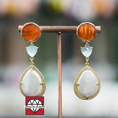 orecchini a perno di bronzo con occhi