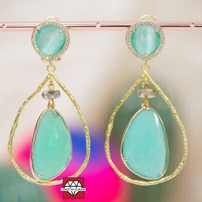 orecchini a perno di bronzo e zirconi