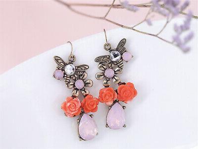 orecchini clip fiore rosso cremoso e scintillante