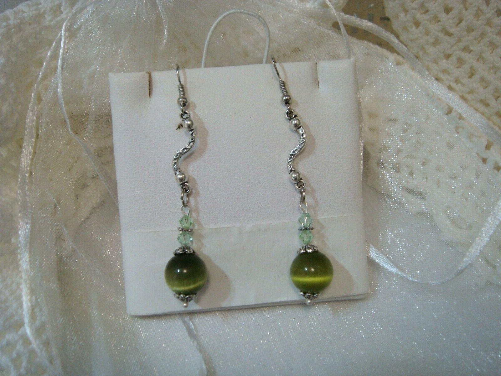 orecchini con swarovski verdi e perle occhi