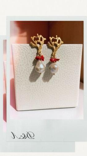 orecchini corallo in zampa pendenti con scaramazze