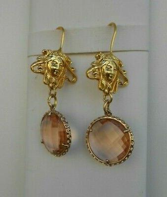 orecchini dorati per lobi forati pendenti testa