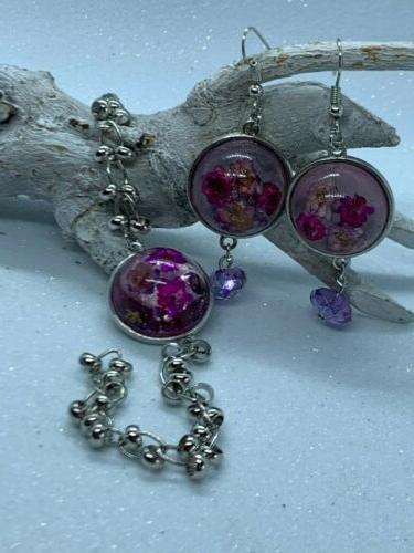 orecchini e bracciiale con ciondolo in resina