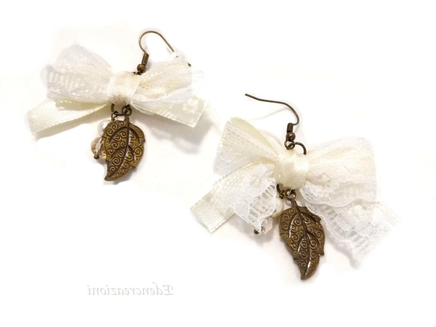 orecchini in bronzo ciondolo foglia cristallo perla