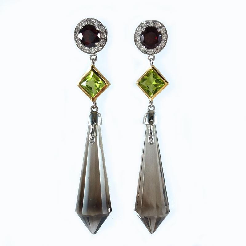 orecchini in oro bianco e giallo granati