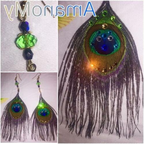 orecchini in piume di pavone con strass