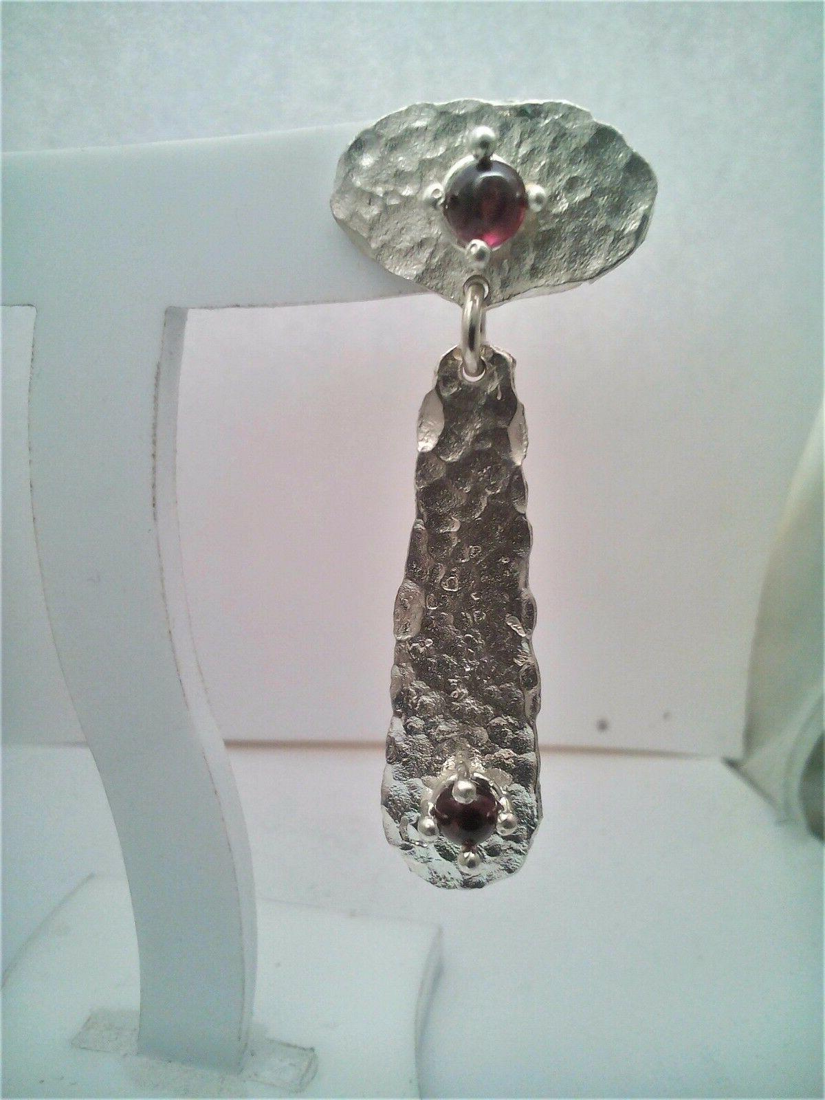 orecchini lavorazione martellata cabochon granato in argento