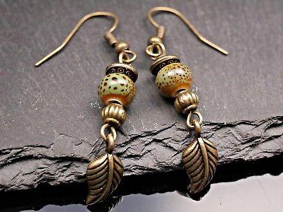 orecchini pendenti foglia piuma oro