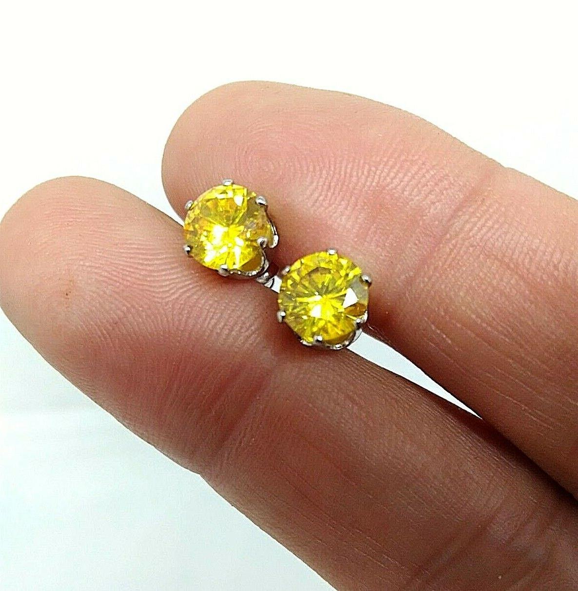 orecchini punto luce in acciaio per uomo