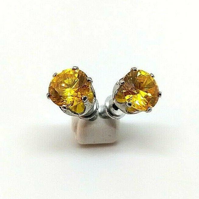 orecchini punto luce limone in acciaio per