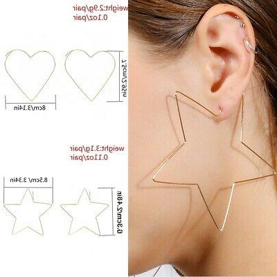 paio orecchini dorati grandi forma stella modern