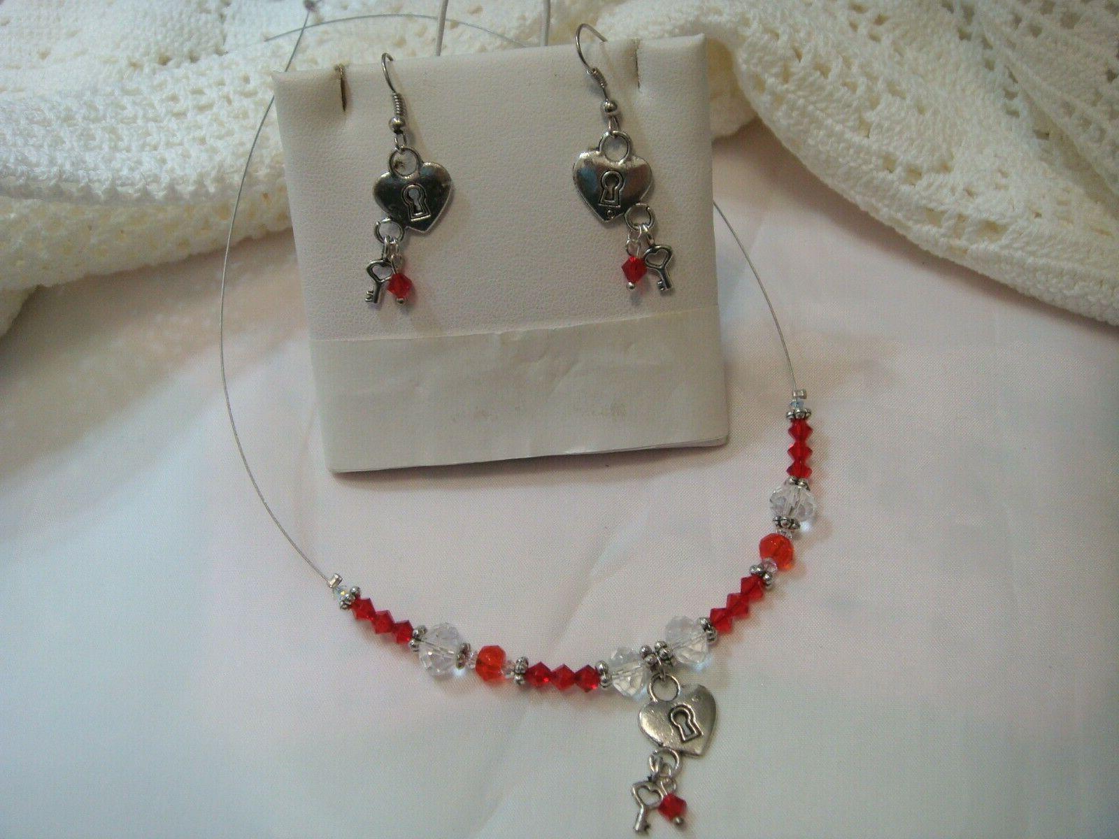 parure swarovski rossi e cuoricino con chiave